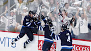 May 4, 2025; Winnipeg, Manitoba, CAN; Winnipeg Jets center Cole Perfetti (91) celebrates after his goal against the St. Louis Blues with teammates left wing Kyle Connor (81) and defenseman Neal Pionk (4) in the third period in game seven of the first round of the 2025 Stanley Cup Playoffs at Canada Life Centre. Mandatory Credit: James Carey Lauder-Imagn Images