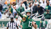Nov 1, 2025; Waco, Texas, USA; Baylor Bears quarterback Sawyer Robertson (13) throws downfield against the UCF Knights during the first half at McLane Stadium. Mandatory Credit: Raymond Carlin III-Imagn Images