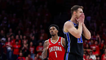 Feb 22, 2025; Tucson, Arizona, USA; Arizona Wildcats guard Caleb Love and BYU Cougars guard Trevin Knell (21) both react during the second half at McKale Center. Mandatory Credit: Aryanna Frank-Imagn Images