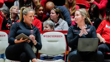 (Right) Wisconsin Badgers women's volleyball Assistant Coach Annemarie Hickey is seen talking to (left) Associate Head Coach Brittany Dildine during the first set of the game against Nebraska on Friday November 24, 2023 at the UW Field House in Madison, Wis. Jovanny Hernandez / Milwaukee Journal Sentinel