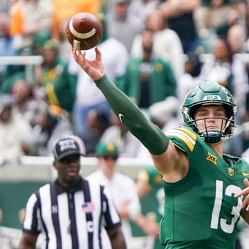 Nov 1, 2025; Waco, Texas, USA; Baylor Bears quarterback Sawyer Robertson (13) throws downfield against the UCF Knights during the first half at McLane Stadium. Mandatory Credit: Raymond Carlin III-Imagn Images