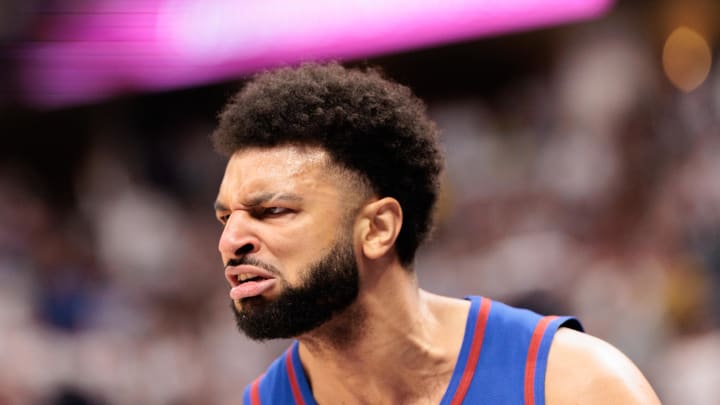 Apr 20, 2024; Denver, Colorado, USA; Denver Nuggets guard Jamal Murray (27) reacts to dunking the ball during the first quarter against the Los Angeles Lakers in game one of the first round for the 2024 NBA playoffs at Ball Arena. Mandatory Credit: Andrew Wevers-USA TODAY Sports