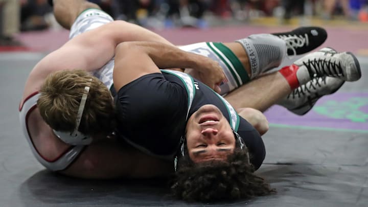 Jarrel Miller of St. Edward (bottom) struggles against Adam Waters of Faith Christian Academy during their 190 pound semifinal match during the 2024 Ironman Wrestling Tournament at Walsh Jesuit High School on Saturday, Dec. 7, 2024, in Cuyahoga Falls, Ohio. Waters was a champion again this weekend at the Escape the Rock Tournament at Pennsylvania's Council Rock High School. Jarrel Miller of St. Edward (bottom) struggles against Adam Waters of Faith Christian Academy during their 190 pound semifinal match during the 2024 Ironman Wrestling Tournament at Walsh Jesuit High School on Saturday, Dec. 7, 2024, in Cuyahoga Falls, Ohio. Waters was a champion again this weekend at the Escape the Rock Tournament at Pennsylvania's Council Rock High School.