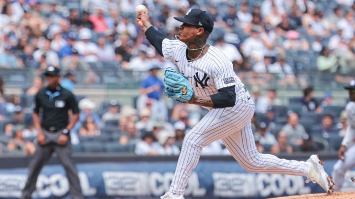 Aug 11, 2024; Bronx, New York, USA; New York Yankees starting pitcher Marcus Stroman (0) delivers a pitch during the first inning against the Texas Rangers at Yankee Stadium. Mandatory Credit: Vincent Carchietta-USA TODAY Sports