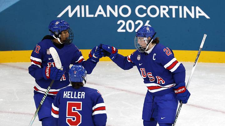 Feb 7, 2026; Milan, Italy; Hilary Knight (21) of the United States celebrates with Laila Edwards (10) of the United States after scoring a goal against Finland  in women's ice hockey group A play during the Milano Cortina 2026 Olympic Winter Games at Milano Rho Ice Hockey Arena. Mandatory Credit: David W Cerny/Reuters via Imagn Images
