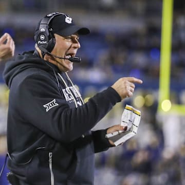Oct 25, 2025; Morgantown, West Virginia, USA; West Virginia Mountaineers head coach Rich Rodriguez calls out a play during the third quarter against the Texas Christian University Horned Frogs at Milan Puskar Stadium. Mandatory Credit: Ben Queen-Imagn Images