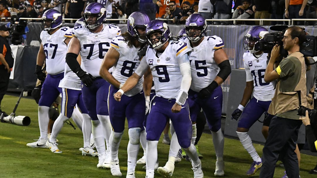 Sep 8, 2025; Chicago, Illinois, USA; Minnesota Vikings quarterback J.J. McCarthy (9) reacts after scoring a touchdown against the Chicago Bears during the second half at Soldier Field. Mandatory Credit: Matt Marton-Imagn Images