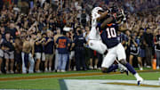 Sep 26, 2025; Charlottesville, Virginia, USA; Virginia Cavaliers defensive back Ja'son Prevard (10) makes a game winning interception in the end zone on a pass intended for Florida State Seminoles wide receiver Squirrel White (4) in the second overtime period at Scott Stadium. Mandatory Credit: Geoff Burke-Imagn Images