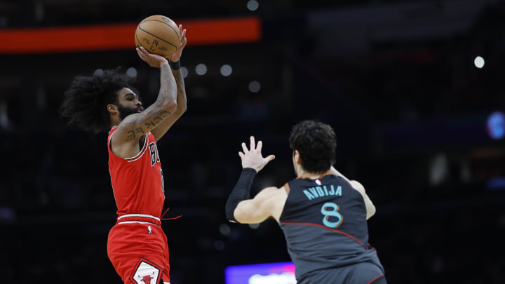 Apr 12, 2024; Washington, District of Columbia, USA; Chicago Bulls guard Coby White (0) shoots the ball over Washington Wizards forward Deni Avdija (8) in the second half at Capital One Arena. Mandatory Credit: Geoff Burke-USA TODAY Sports