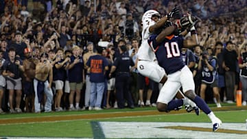 Sep 26, 2025; Charlottesville, Virginia, USA; Virginia Cavaliers defensive back Ja'son Prevard (10) makes a game winning interception in the end zone on a pass intended for Florida State Seminoles wide receiver Squirrel White (4) in the second overtime period at Scott Stadium. Mandatory Credit: Geoff Burke-Imagn Images