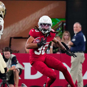 Cardinals wide out Xavier Weaver (30) runs with the ball against the Saints during a game at State Farm Stadium in Glendale, Ariz., on Saturday, Aug. 10, 2024.