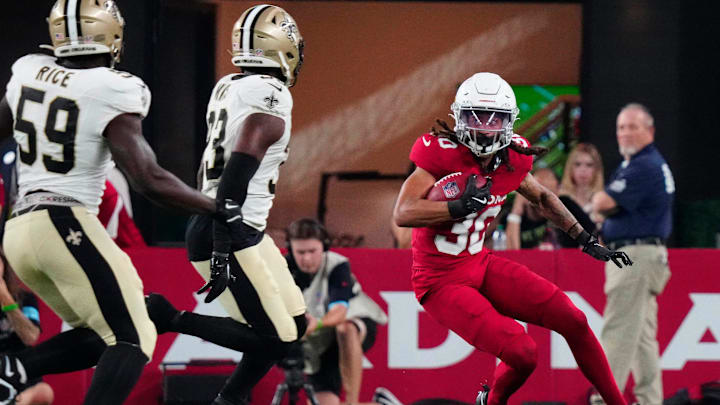 Cardinals wide out Xavier Weaver (30) runs with the ball against the Saints during a game at State Farm Stadium in Glendale, Ariz., on Saturday, Aug. 10, 2024.