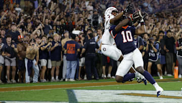 Sep 26, 2025; Charlottesville, Virginia, USA; Virginia Cavaliers defensive back Ja'son Prevard (10) makes a game winning interception in the end zone on a pass intended for Florida State Seminoles wide receiver Squirrel White (4) in the second overtime period at Scott Stadium. Mandatory Credit: Geoff Burke-Imagn Images