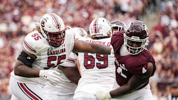 Oct 28, 2023; College Station, Texas, USA; South Carolina Gamecocks offensive lineman Jakai Moore (55) blocks Texas A&M Aggies defensive lineman Shemar Stewart (4) during the second quarter at Kyle Field. Mandatory Credit: Dustin Safranek-Imagn Images