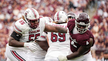 Oct 28, 2023; College Station, Texas, USA; South Carolina Gamecocks offensive lineman Jakai Moore (55) blocks Texas A&M Aggies defensive lineman Shemar Stewart (4) during the second quarter at Kyle Field. 