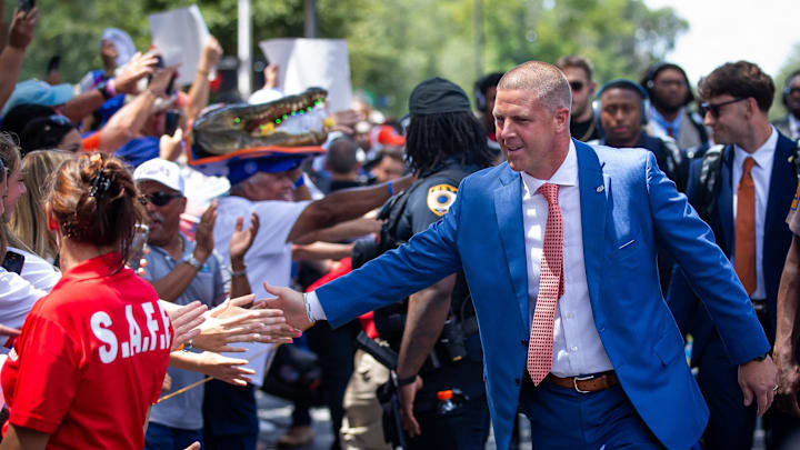 Florida Gators head coach Billy Napier shakes hands during Gator Walk for the season opener at Ben Hill Griffin Stadium in Gainesville, FL on Saturday, August 31, 2024 against the University of Miami Hurricanes. [Doug Engle/Gainesville Sun]