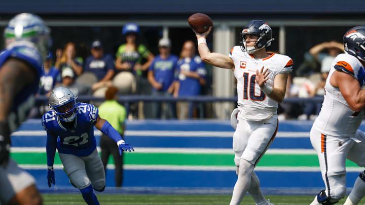 Sep 8, 2024; Seattle, Washington, USA; Denver Broncos quarterback Bo Nix (10) passes against the Seattle Seahawks during the second quarter at Lumen Field. Mandatory Credit: Joe Nicholson-Imagn Images