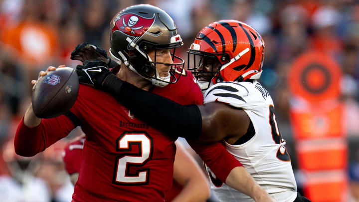 Cincinnati Bengals defensive end Myles Murphy (99) hits Tampa Bay Buccaneers quarterback Kyle Trask (2) causing an incomplete pass in the second quarter of the NFL preseason game at Paycor Stadium in Cincinnati on Saturday, August 10, 2024.