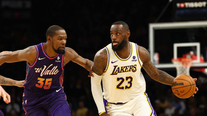 Feb 25, 2024; Phoenix, Arizona, USA; Los Angeles Lakers forward LeBron James (23) against Phoenix Suns forward Kevin Durant (35) at Footprint Center. Mandatory Credit: Mark J. Rebilas-USA TODAY Sports