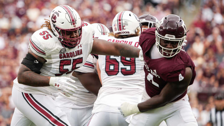 Oct 28, 2023; College Station, Texas, USA; South Carolina Gamecocks offensive lineman Jakai Moore (55) blocks Texas A&M Aggies defensive lineman Shemar Stewart (4) during the second quarter at Kyle Field. 