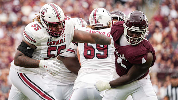 South Carolina Gamecocks offensive lineman Jakai Moore (55) blocks Texas A&M Aggies defensive lineman Shemar Stewart (4). 