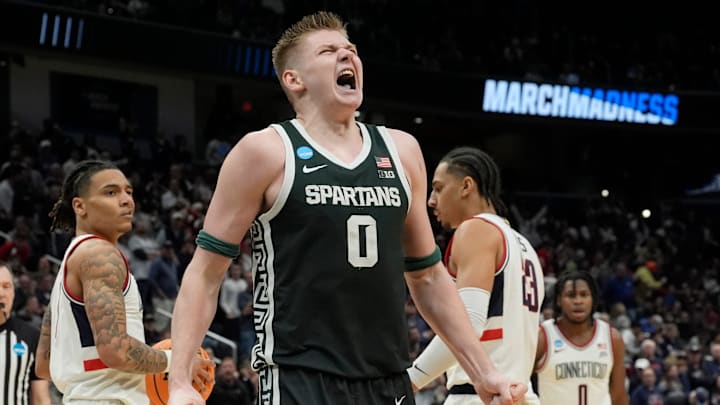 Michigan State forward Jaxon Kohler (0) reacts after getting fouled by Connecticut guard Solo Ball (1) during the second half of the 2026 NCAA Men's Basketball East Regional game against UConn at Capital One Arena in Washington DC on Friday, March 27, 2026. 
Michigan State lost the game 67-63.