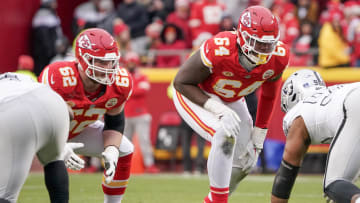 Dec 25, 2023; Kansas City, Missouri, USA; Kansas City Chiefs guard Joe Thuney (62) and offensive tackle Wanya Morris (64) at the line of scrimmage against the Las Vegas Raiders during the game at GEHA Field at Arrowhead Stadium. Mandatory Credit: Denny Medley-USA TODAY Sports