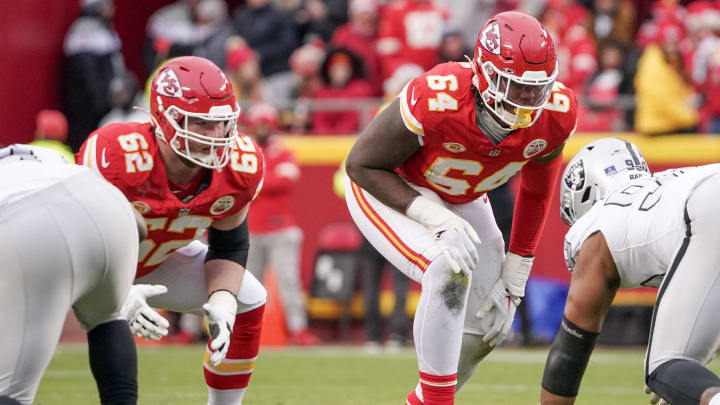 Dec 25, 2023; Kansas City, Missouri, USA; Kansas City Chiefs guard Joe Thuney (62) and offensive tackle Wanya Morris (64) at the line of scrimmage against the Las Vegas Raiders during the game at GEHA Field at Arrowhead Stadium. Mandatory Credit: Denny Medley-USA TODAY Sports