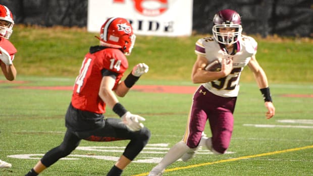 Killingly's Hayden Allard looks for some running room against New Canaan during the Class L quarterfinals last season.
