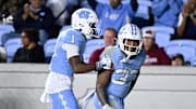 Nov 8, 2025; Chapel Hill, North Carolina, USA; North Carolina Tar Heels running back Davion Gause (37) celebrates with wide receiver Jordan Shipp (1) after scoring a touchdown in the third quarter at Kenan Stadium. Mandatory Credit: Bob Donnan-Imagn Images