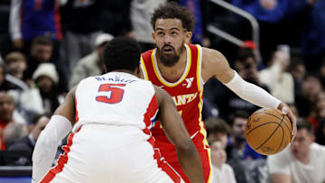 Feb 3, 2025; Detroit, Michigan, USA;  Atlanta Hawks guard Trae Young (11) dribbles defended by Detroit Pistons guard Malik Beasley (5) in the second half at Little Caesars Arena. Mandatory Credit: Rick Osentoski-Imagn Images