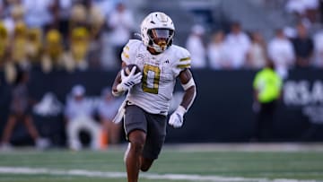 Oct 11, 2025; Atlanta, Georgia, USA; Georgia Tech Yellow Jackets running back Malachi Hosley (0) runs the ball against the Virginia Tech Hokies in the fourth quarter at Bobby Dodd Stadium at Hyundai Field. Mandatory Credit: Brett Davis-Imagn Images

