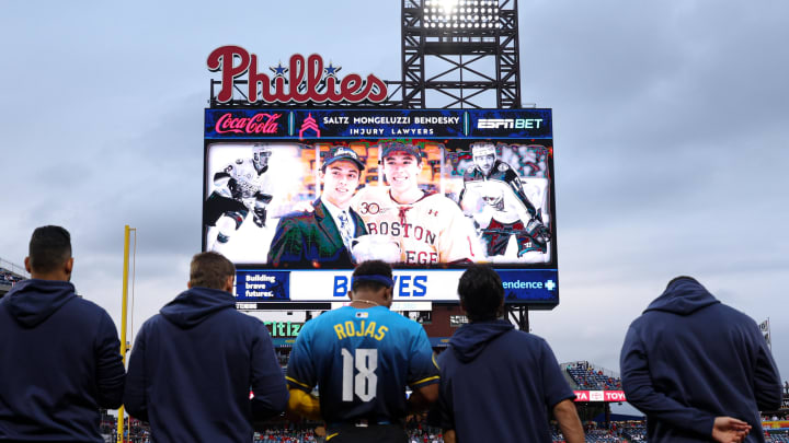 Aug 30, 2024; Philadelphia, Pennsylvania, USA; Players and fans stand for a moment of silence for NHL player Johnny Gaudreau who passed away the night before the game between the Philadelphia Phillies and the Atlanta Braves at Citizens Bank Park. Mandatory Credit: Bill Streicher-USA TODAY Sports