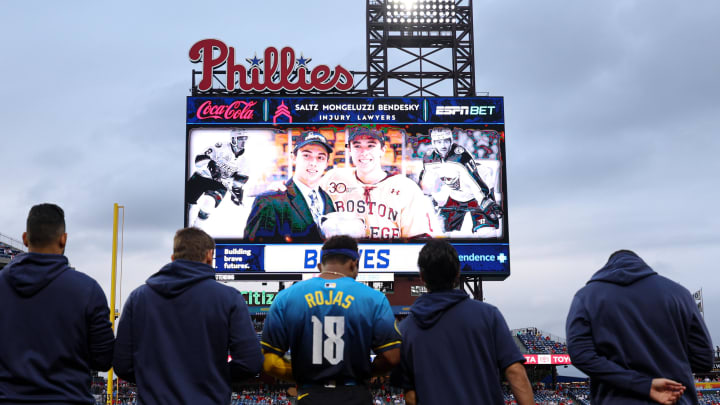 Aug 30, 2024; Philadelphia, Pennsylvania, USA; Players and fans stand for a moment of silence for NHL player Johnny Gaudreau who passed away the night before the game between the Philadelphia Phillies and the Atlanta Braves at Citizens Bank Park. Mandatory Credit: Bill Streicher-USA TODAY Sports