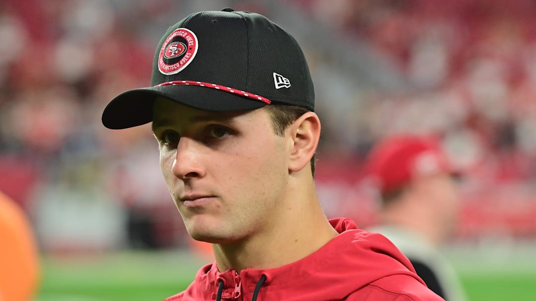 Jan 5, 2025; Glendale, Arizona, USA;  San Francisco 49ers quarterback Brock Purdy (13) looks on after losing to the Arizona Cardinals at State Farm Stadium. Mandatory Credit: Matt Kartozian-Imagn Images