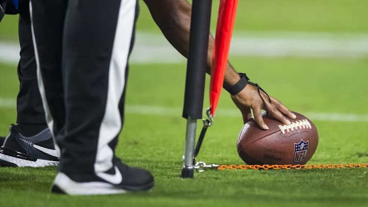 Oct 28, 2021; Glendale, Arizona, USA; Detailed view as NFL referee measures the football for a first down with yard markers during the Arizona Cardinals game against the Green Bay Packers. Oct 28, 2021; Glendale, Arizona, USA; Detailed view as NFL referee measures the football for a first down with yard markers during the Arizona Cardinals game against the Green Bay Packers.