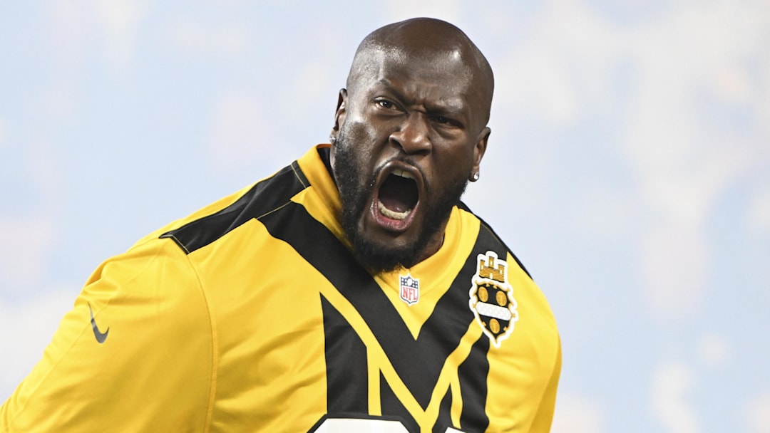 Oct 26, 2025; Pittsburgh, Pennsylvania, USA;  Pittsburgh Steelers former player James Harrison pumps up the crowd with a terrible towel prior to the game against the Green Bay Packers at Acrisure Stadium. Mandatory Credit: Barry Reeger-Imagn Images