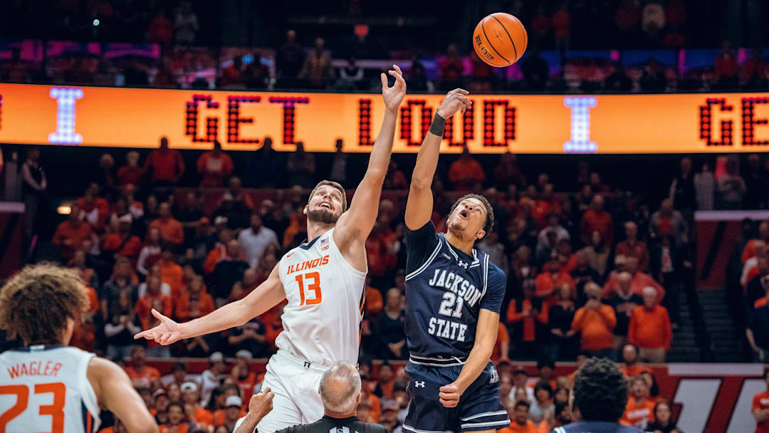Illinois center Tomislav Ivisic (13) jumps the opening tip against Jackson State in the Illini's 113-55 win over the Tigers in their season opener Monday at the State Farm Center in Champaign, Illinois.