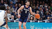 Jan 8, 2025; Villanova, Pennsylvania, USA; Connecticut Huskies forward Alex Karaban (11) controls the ball against the Villanova Wildcats in the first half at William B. Finneran Pavilion. Mandatory Credit: Kyle Ross-Imagn Images