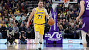 Feb 12, 2025; Salt Lake City, Utah, USA;  Los Angeles Lakers guard Luka Doncic (77) dribbles during the first quarter against the Utah Jazz at Delta Center. Mandatory Credit: Chris Nicoll-Imagn Images