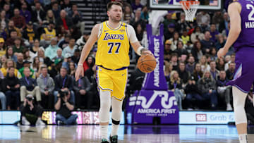 Feb 12, 2025; Salt Lake City, Utah, USA;  Los Angeles Lakers guard Luka Doncic (77) dribbles during the first quarter against the Utah Jazz at Delta Center. Mandatory Credit: Chris Nicoll-Imagn Images