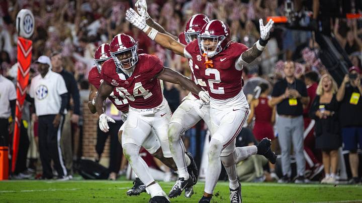 Sep 28, 2024; Tuscaloosa, Alabama, USA; Alabama Crimson Tide defensive back Zabien Brown (2) and linebacker Que Robinson (34) celebrate after an interception against the Georgia Bulldogs in the fourth quarter at Bryant-Denny Stadium. Mandatory Credit: Will McLelland-Imagn Images