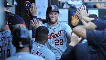 Aug 25, 2024; Chicago, Illinois, USA; Detroit Tigers center fielder Parker Meadows (22) celebrates in the dugout with teammates after scoring during the eighth inning against the Chicago White Sox at Guaranteed Rate Field. 