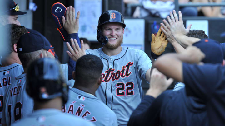 Aug 25, 2024; Chicago, Illinois, USA; Detroit Tigers center fielder Parker Meadows (22) celebrates in the dugout with teammates after scoring during the eighth inning against the Chicago White Sox at Guaranteed Rate Field. 