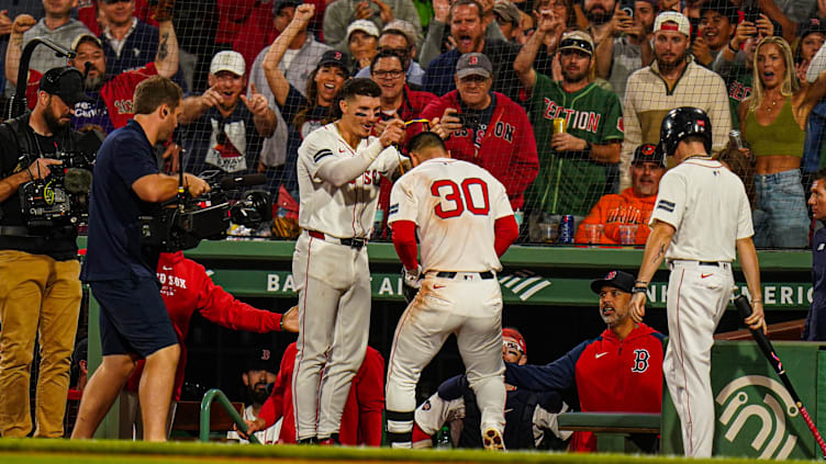 Sep 9, 2024; Boston, Massachusetts, USA; Boston Red Sox right fielder Rob Refsnyder (30) is congratulated after hitting a home run against the Baltimore Orioles in the eighth inning at Fenway Park. Mandatory Credit: David Butler II-Imagn Images