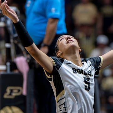 Purdue Junior Taylor Anderson (5) returns a dig