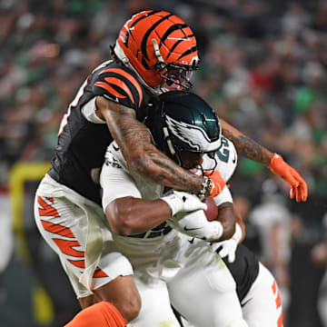 Aug 7, 2025; Philadelphia, Pennsylvania, USA; Cincinnati Bengals safety Daijahn Anthony (33) tackles Philadelphia Eagles running back AJ Dillon (29) at Lincoln Financial Field. Mandatory Credit: Eric Hartline-Imagn Images