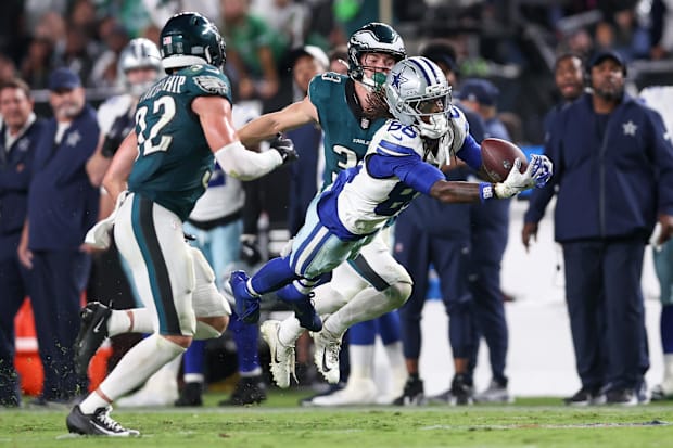 Dallas Cowboys WR CeeDee Lamb is unable to make a reception defended by Eagles S Reed Blankenship and CB Cooper DeJean.