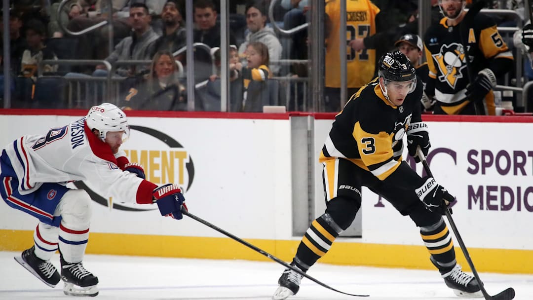 Nov 2, 2024; Pittsburgh, Pennsylvania, USA;  Pittsburgh Penguins defenseman Jack St. Ivany (3) moves the puck ahead of Montreal Canadiens defenseman Mike Matheson (8) during the third period at PPG Paints Arena. Mandatory Credit: Charles LeClaire-Imagn Images