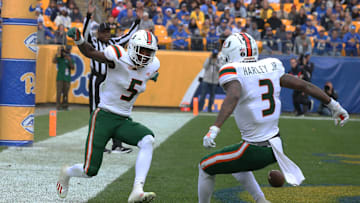 Oct 30, 2021; Pittsburgh, Pennsylvania, USA; Miami Hurricanes wide receiver Key'Shawn Smith (5) celebrates his touchdown with wide receiver Mike Harley (3) against the Pittsburgh Panthers during the third quarter at Heinz Field. Miami won 38-34. Mandatory Credit: Charles LeClaire-Imagn Images
